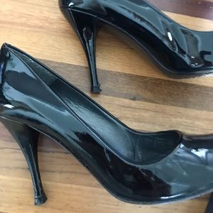 Stuart Weitzman peep-toe heels.